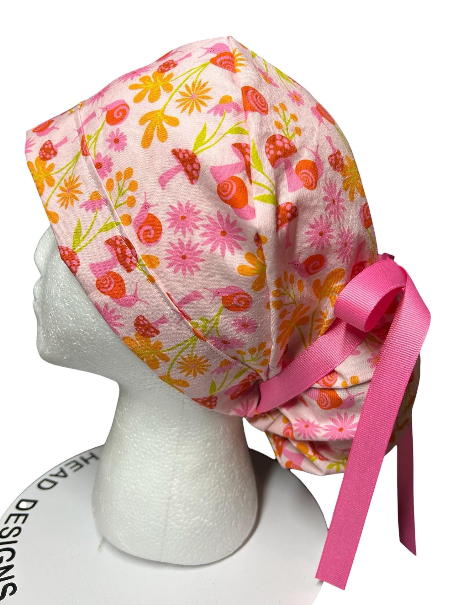 Women’s Ponytail Scrub Cap: Adjustable Cotton Scrub Hat in pink snail fabric