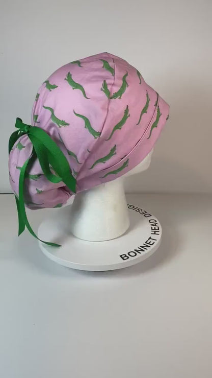 Pink and green alligators women's ponytail scrub cap, Bonnet Head Designs