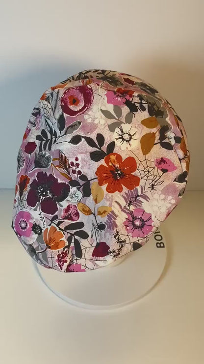 Pink Halloween floral euro scrub hat, women’s eerie Halloween floral euro style scrub cap