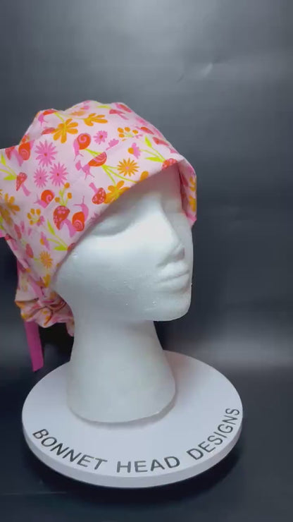 Women’s Ponytail Scrub Cap: Adjustable Cotton Scrub Hat in pink snail fabric