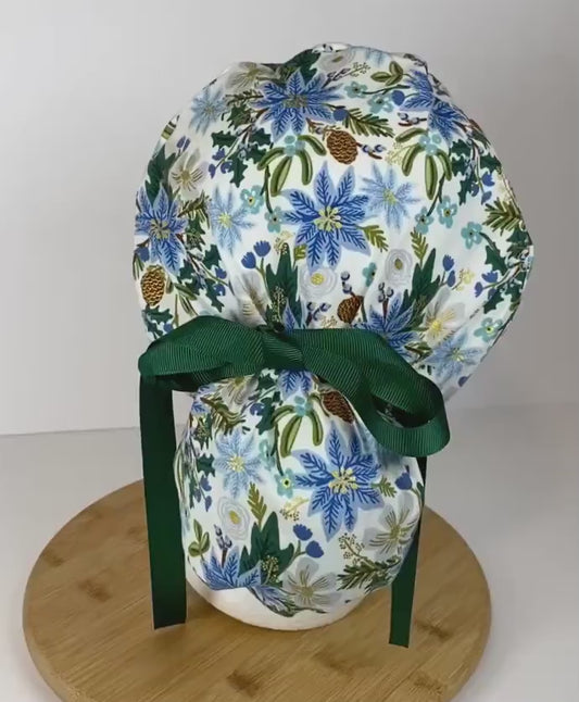 Rifle Paper Co fabric blue and white poinsettias scrub cap, winter floral women’s scrub hat