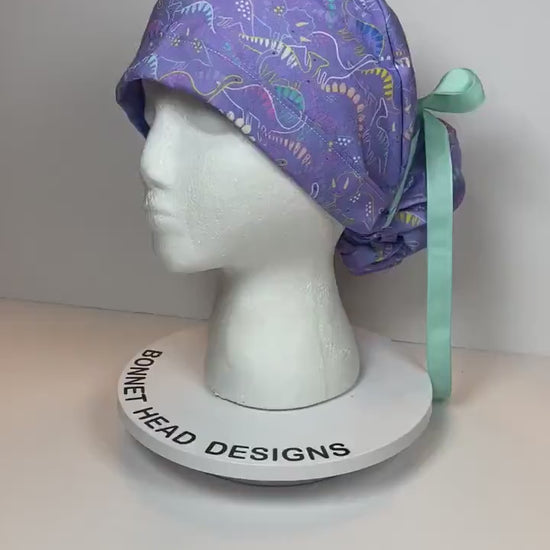 Purple Dinosaur print scrub cap, ponytail scrub hat girly dinosaurs, Bonnet Head Designs