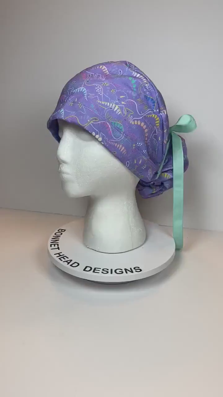 Purple Dinosaur print scrub cap, ponytail scrub hat girly dinosaurs, Bonnet Head Designs