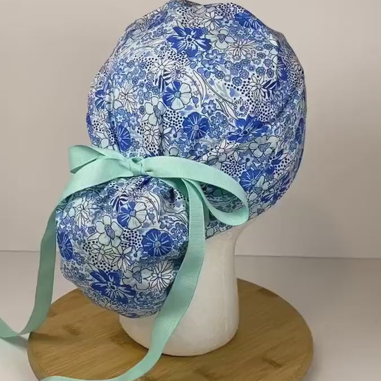 Shades of blue women’s floral scrub cap, blue floral ponytail scrub hat