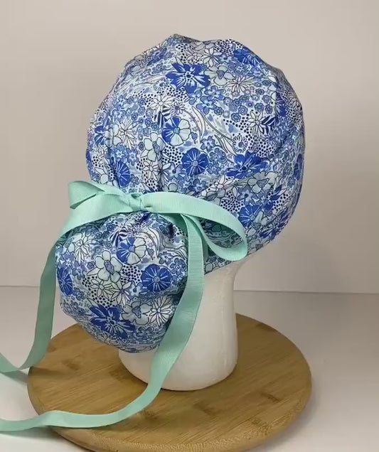 Shades of blue women’s floral scrub cap, blue floral ponytail scrub hat