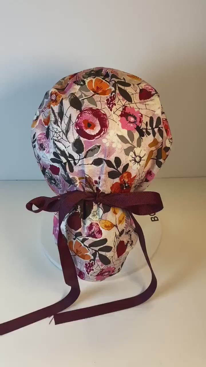 Eerie Halloween pink floral ponytail scrub hat, women’s Halloween floral scrub cap